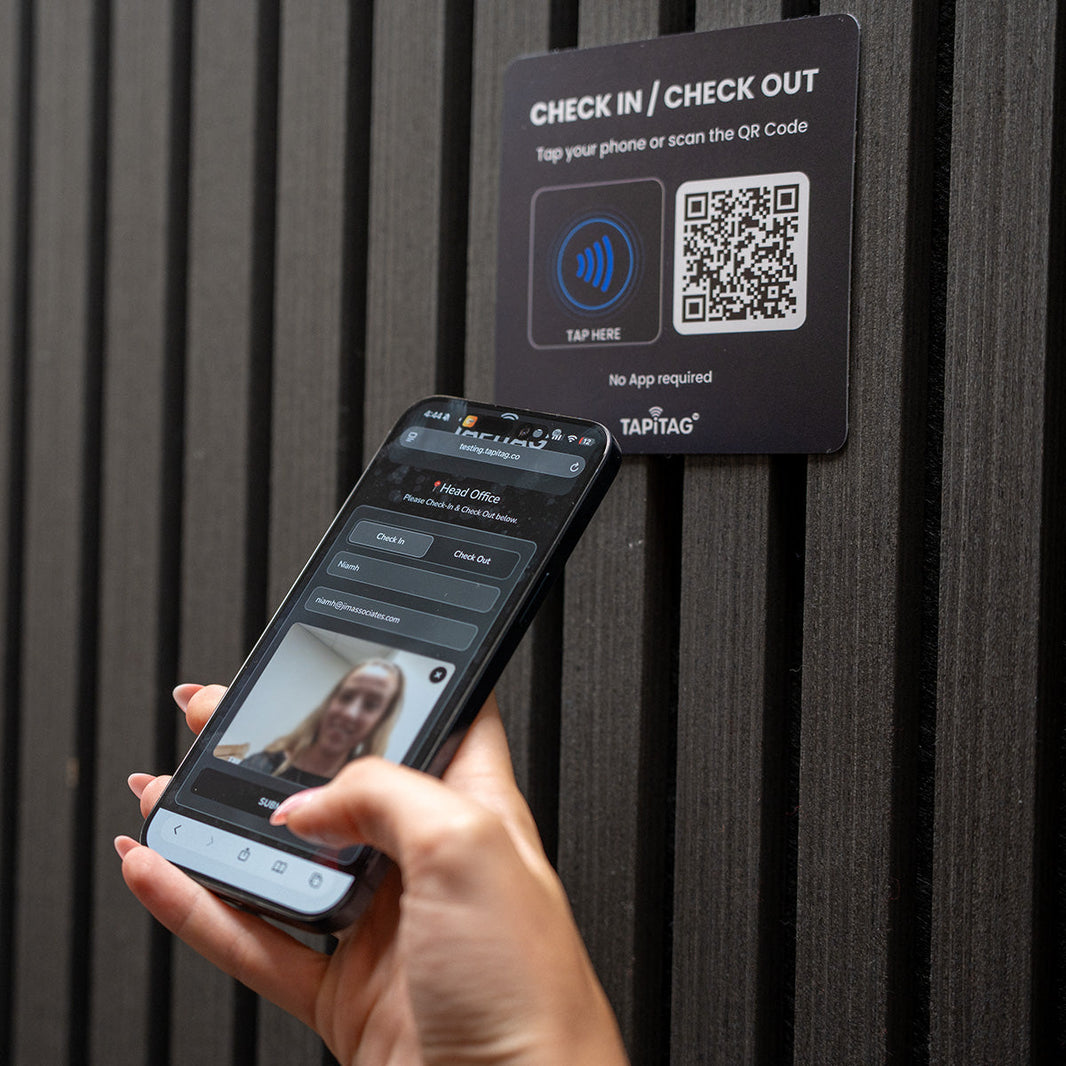 Cleaner using an NFC and QR Check-In Point at an office entrance