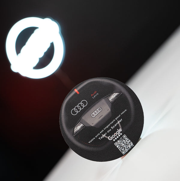 Audi car key fob with a QR code on a black background