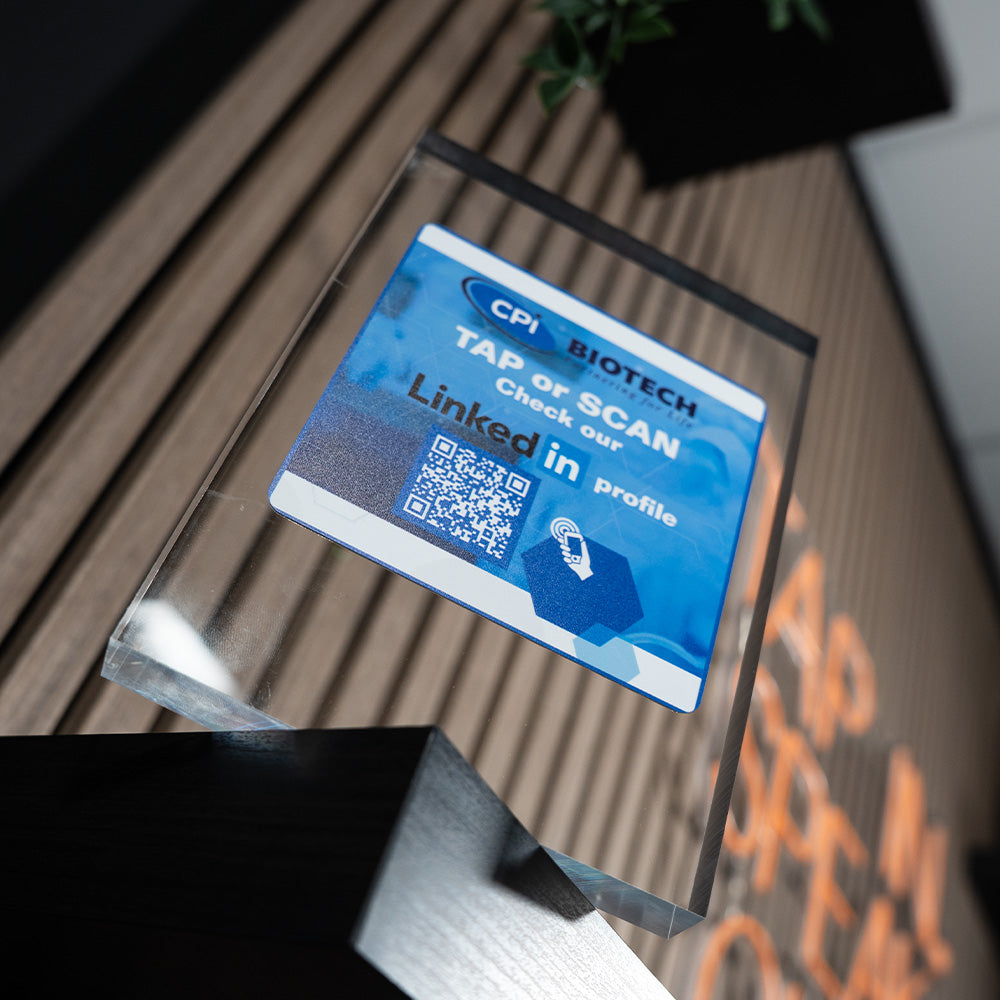 Blue business card with a QR code on a transparent stand