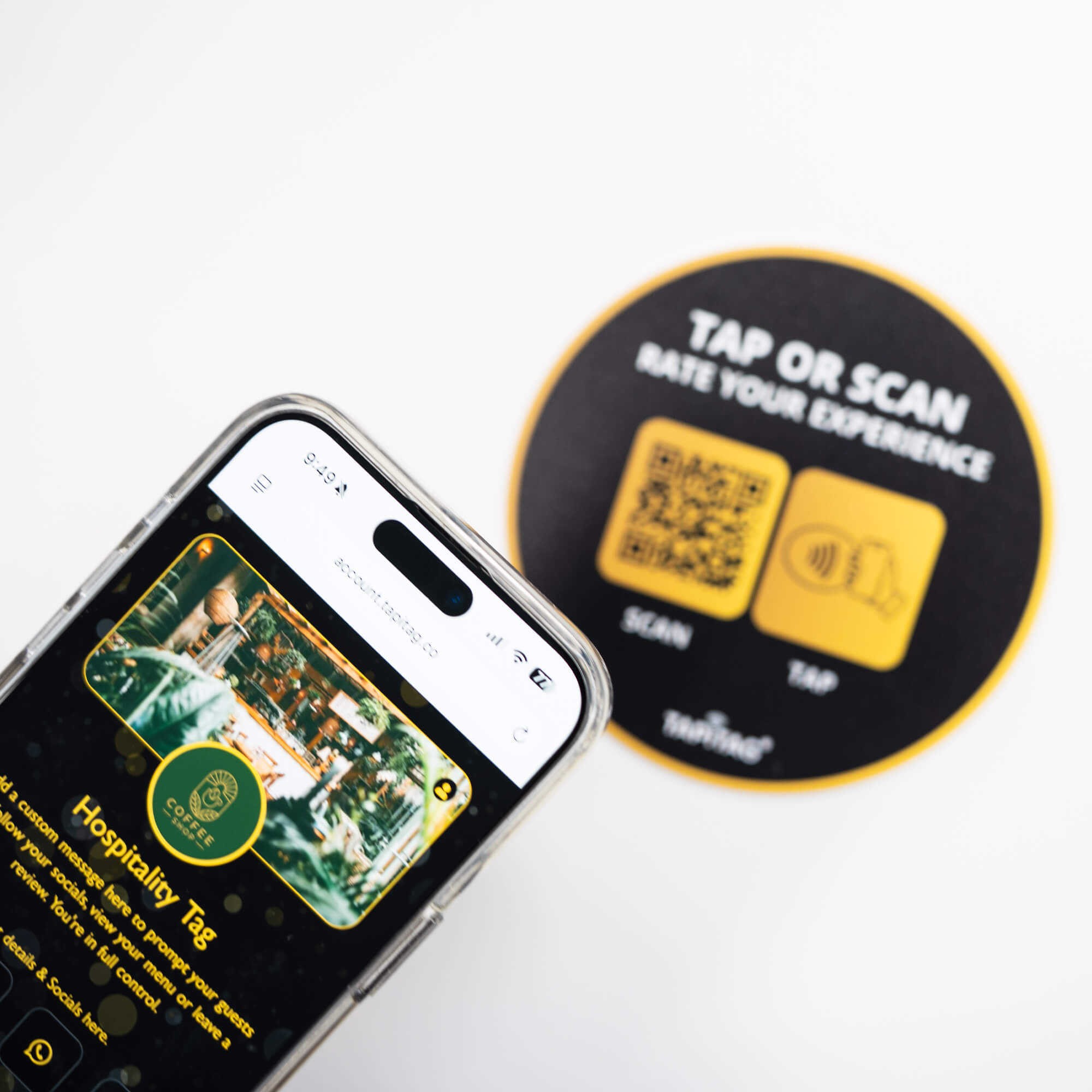 Person tapping TAPiTAG NFC hospitality tag with smartphone to access digital business profile instantly