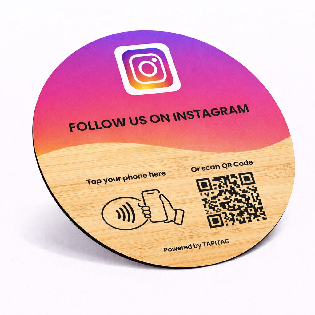 Round wooden coaster with Instagram promotion and QR code on a gradient background