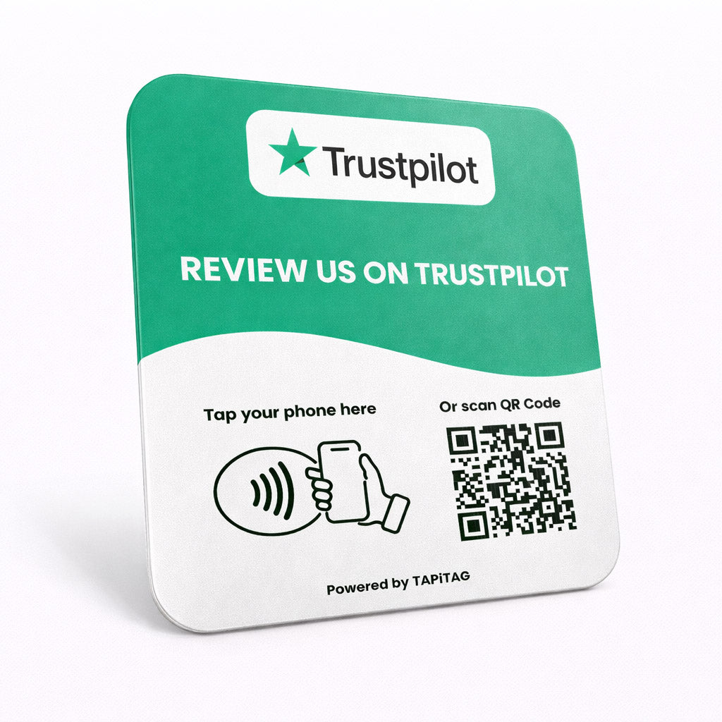 Trustpilot NFC tap-to-follow plate by TAPiTAG with QR code, allowing customers to tap or scan to instantly follow a business on Trustpilot, displayed on a white counter.