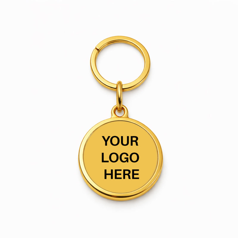 TAPiTAG Gold keychain with 'Your Logo Here' text on a white background