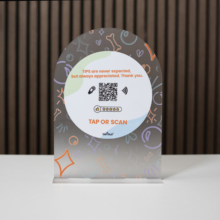 Decorative tipping tray with QR code on a plain background