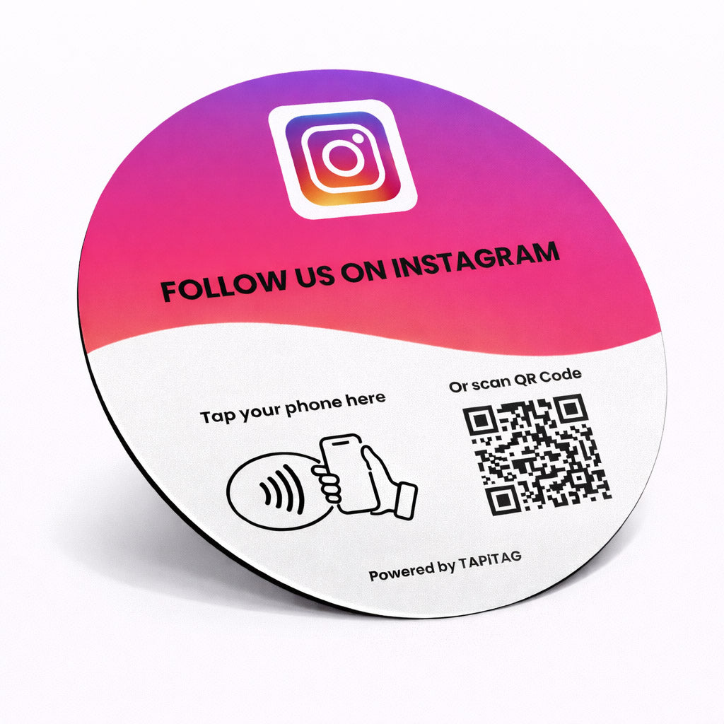 Instagram NFC tap-to-follow plate by TAPiTAG with QR code, allowing customers to tap or scan to instantly follow a business on Instagram, displayed on a white counter.