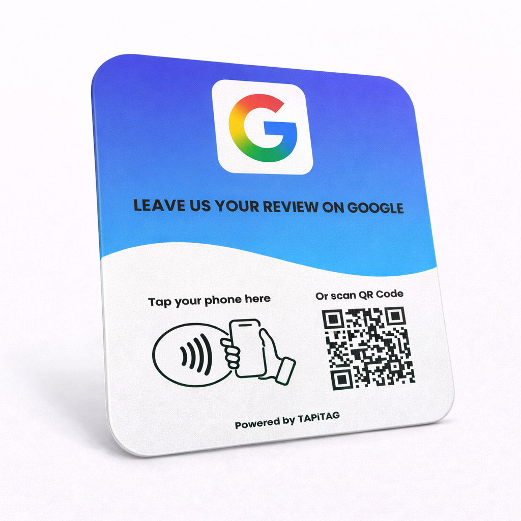 Google Review NFC review plate by TAPiTAG with QR code, allowing customers to tap or scan to instantly review a business on Google, displayed on a white counter.