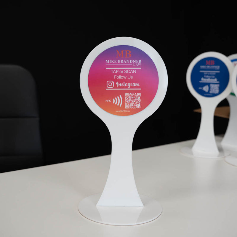 Promotional stand with branded information on a dark background Acrylic Display Stand | Instagram NFC Tag