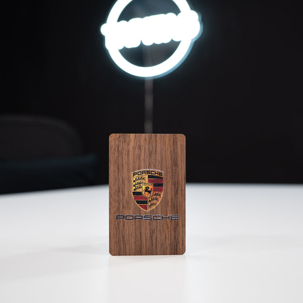 walnut Wooden Digital Business Card, also known as an NFC Business Card with  a dark background