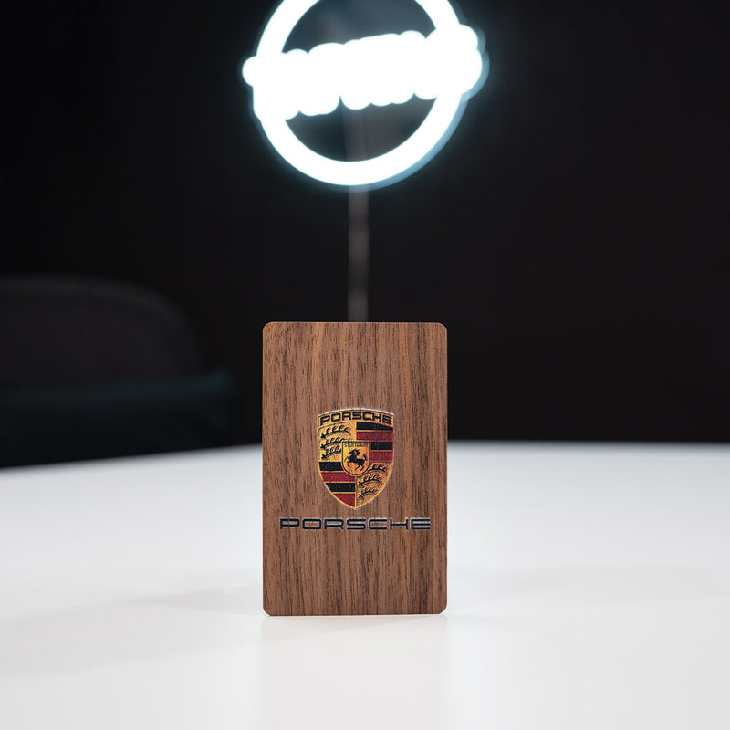 walnut Wooden Digital Business Card, also known as an NFC Business Card with  a dark background