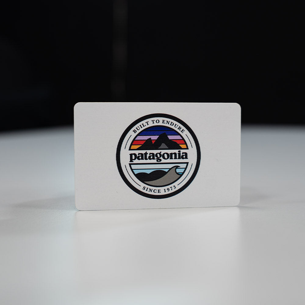 Bamboo Wooden Digital Business Card, also known as an NFC Business Card with Patagonia logo on a white card with a black background