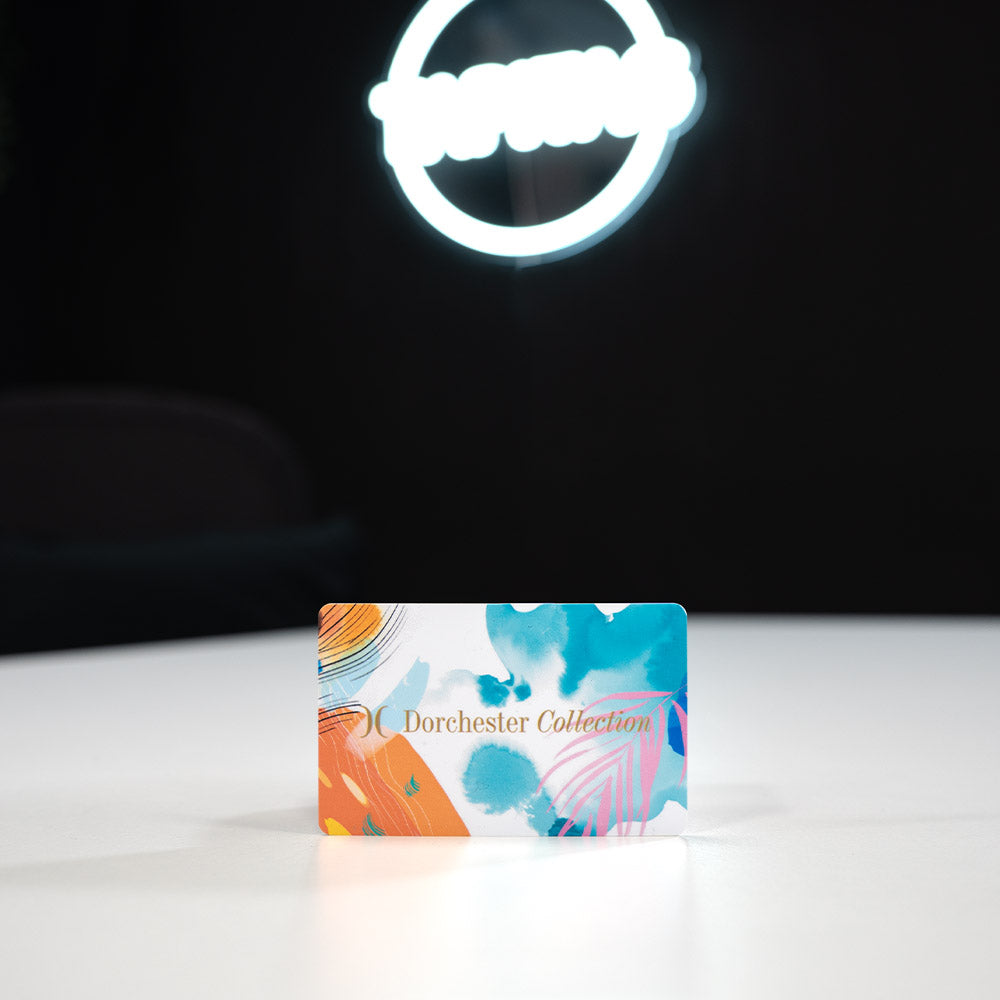 Plastic Digital Business Card, also known as an NFC Business Card Colorful card with 'Dorchester Collection' branding on a white surface with a dark background.