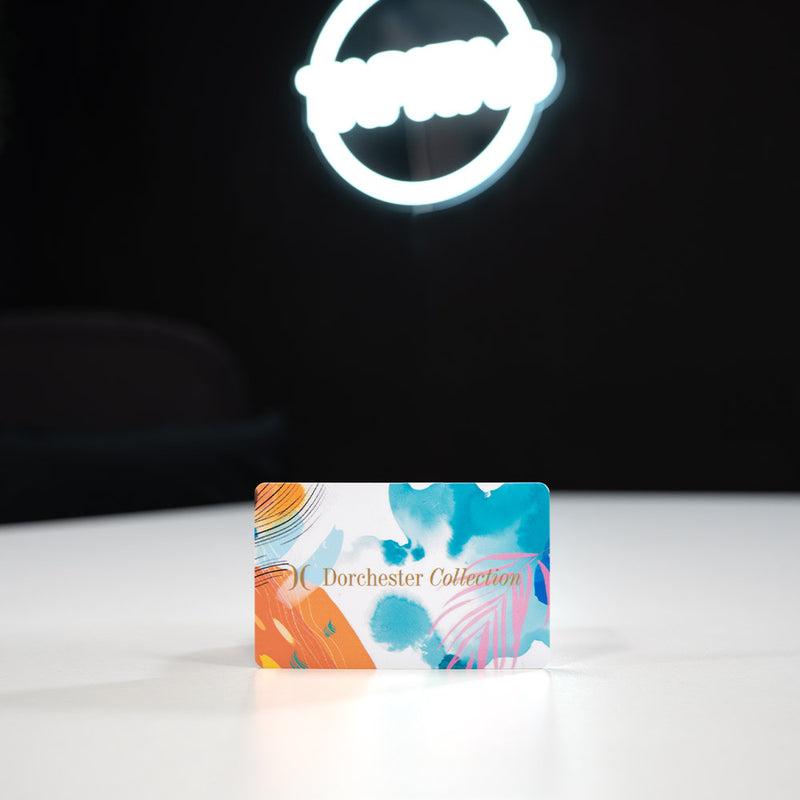 Plastic Digital Business Card, also known as an NFC Business Card Colorful card with 'Dorchester Collection' branding on a white surface with a dark background.