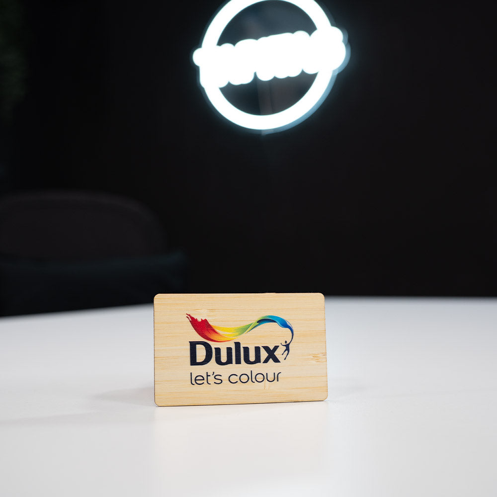 Bamboo Wooden Digital Business Card, also known as an NFC Business Card with Dulux color swatch on a white surface with a dark background