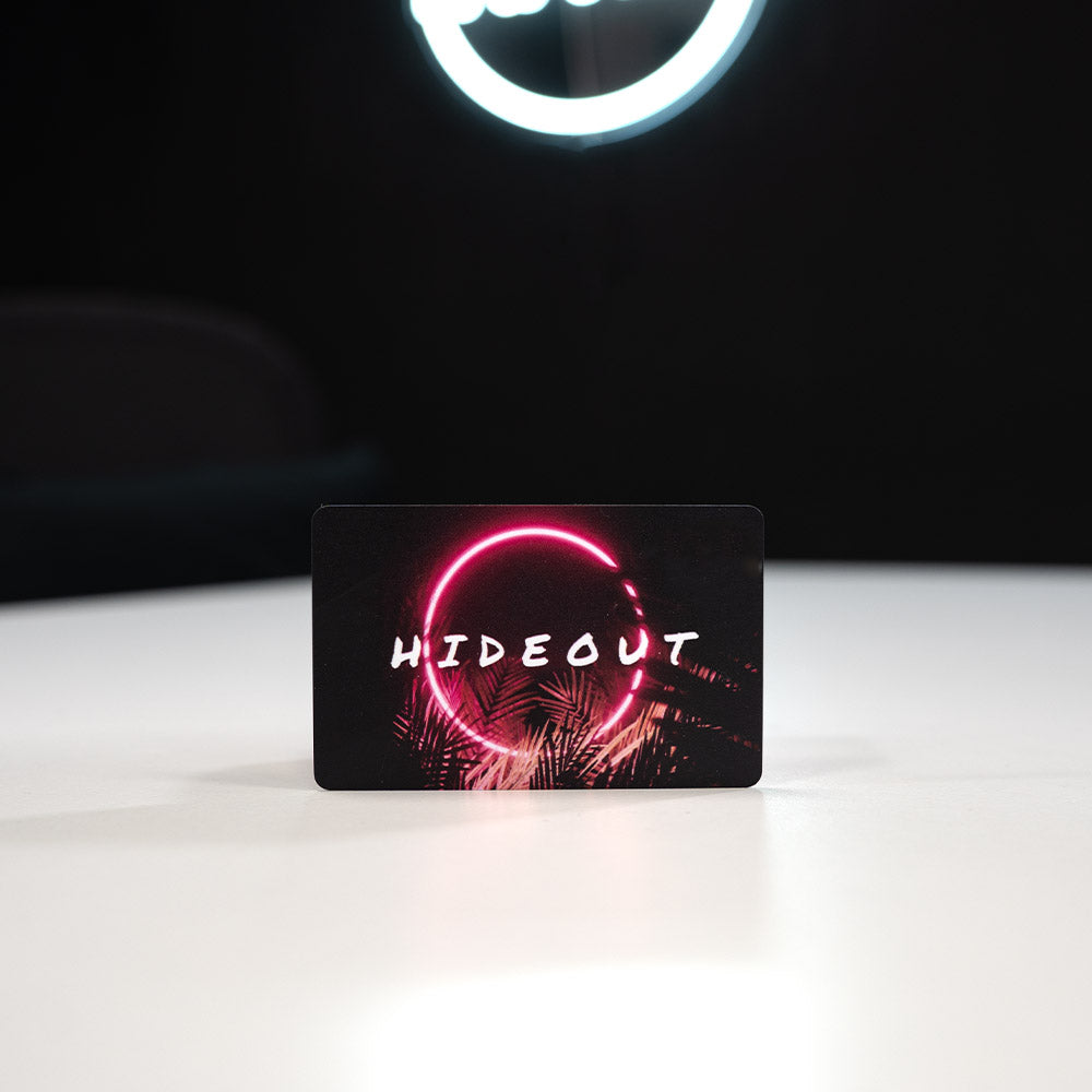 Plastic Digital Business Card, also known as an NFC Business Card with 'HIDEOUT' design featuring a pink circle on a black background, illuminated by a ring light.