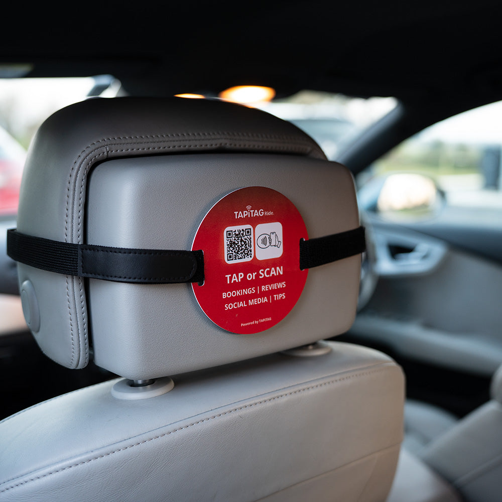 TAPiTAG Ride NFC tag attached to car headrest for contactless bookings, reviews, social media and tips via tap or QR scan