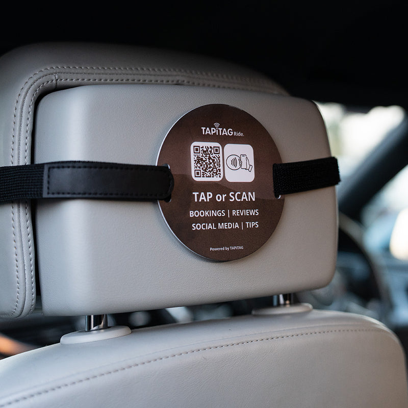 TAPiTAG Ride NFC tag attached to car headrest for contactless bookings, reviews, social media and tips via tap or QR scan