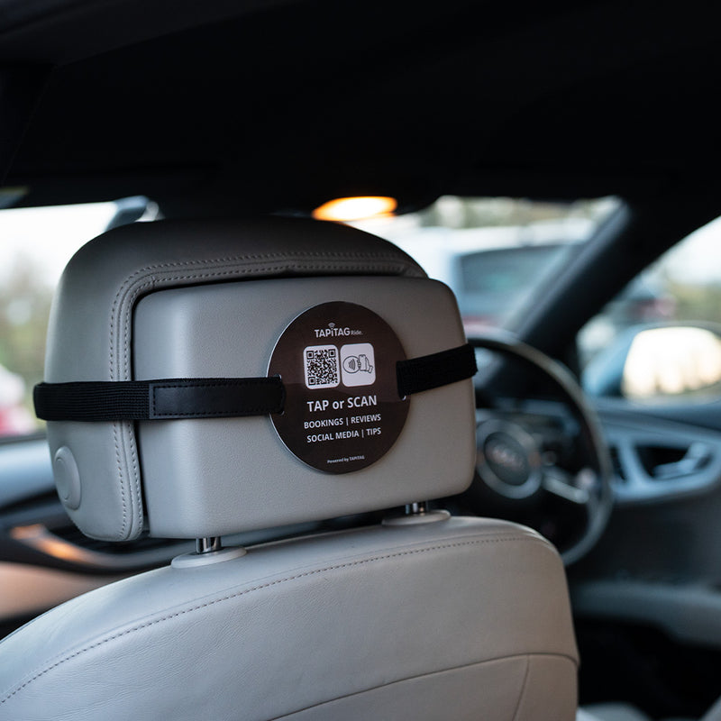 TAPiTAG Ride NFC tag attached to car headrest for contactless bookings, reviews, social media and tips via tap or QR scan