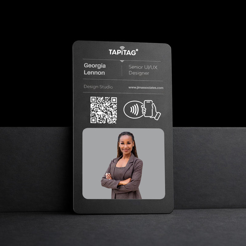Black name tag with a QR code and a photo of a woman on a black background