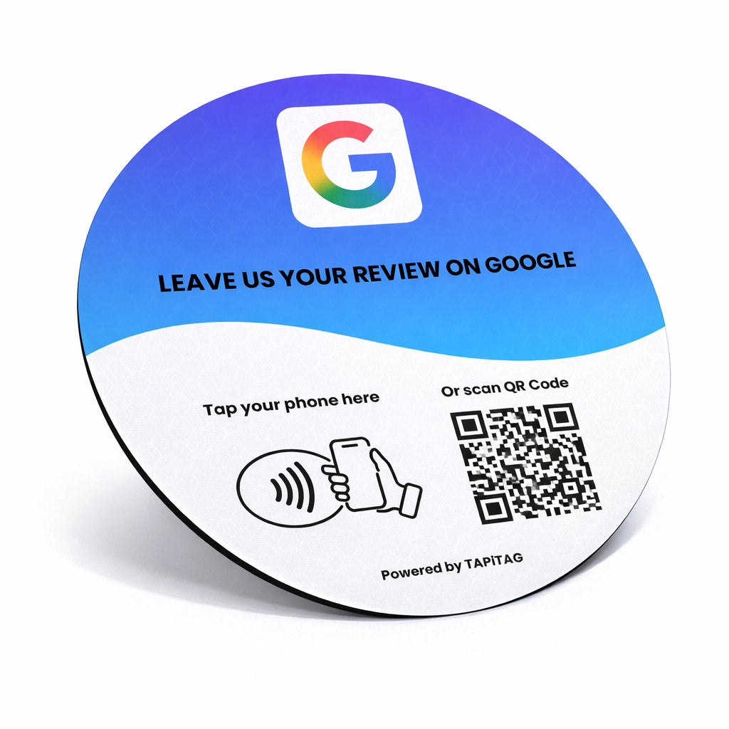 Google Review NFC review plate by TAPiTAG with QR code, allowing customers to tap or scan to instantly review a business on Google, displayed on a white counter.