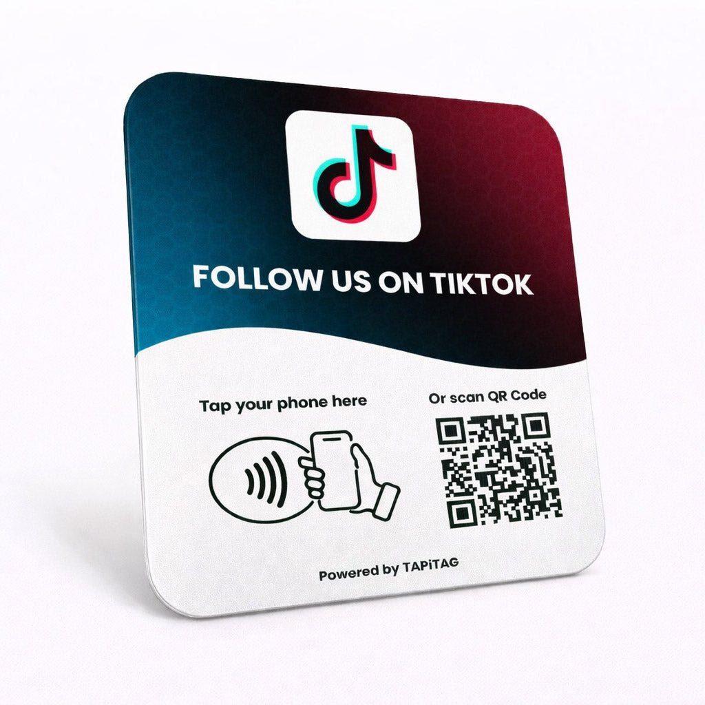 TIKTOK NFC tap-to-follow plate by TAPiTAG with QR code, allowing customers to tap or scan to instantly follow a business on TIKTOK, displayed on a white counter.