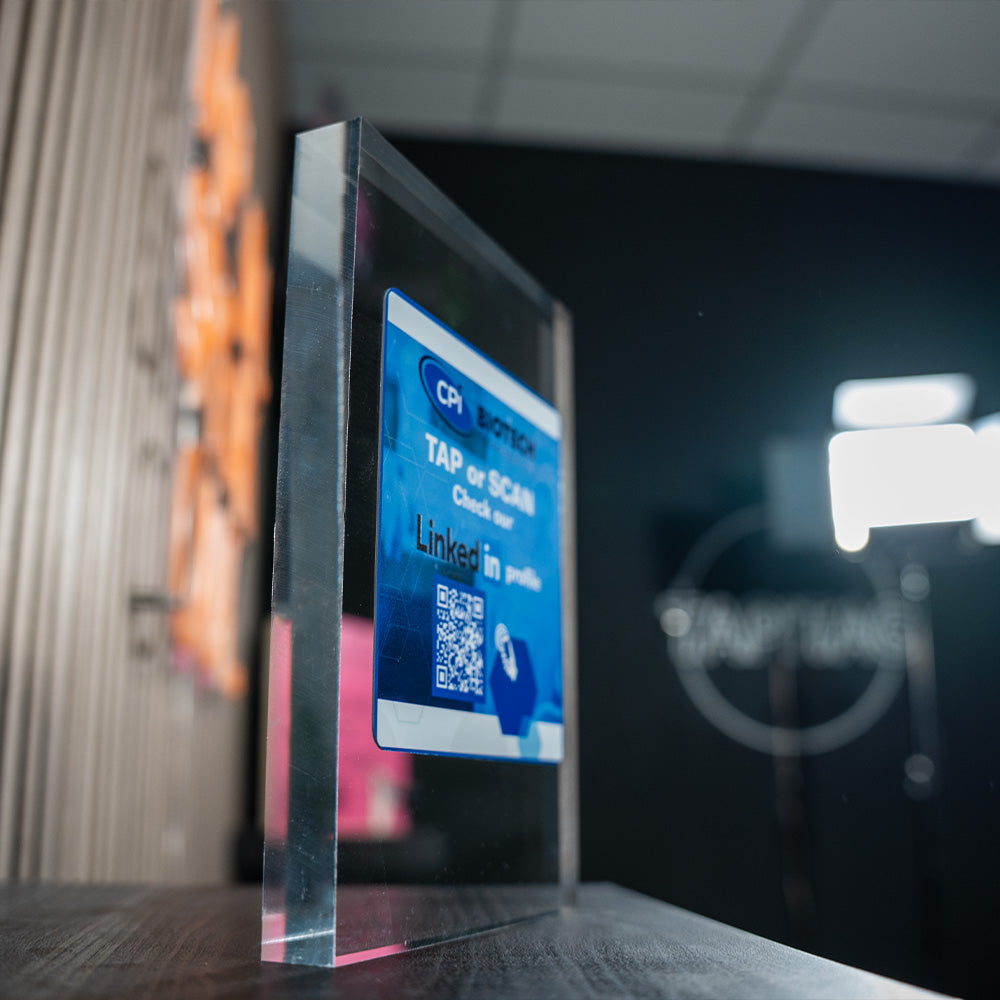 Digital display with a QR code on a blurred background