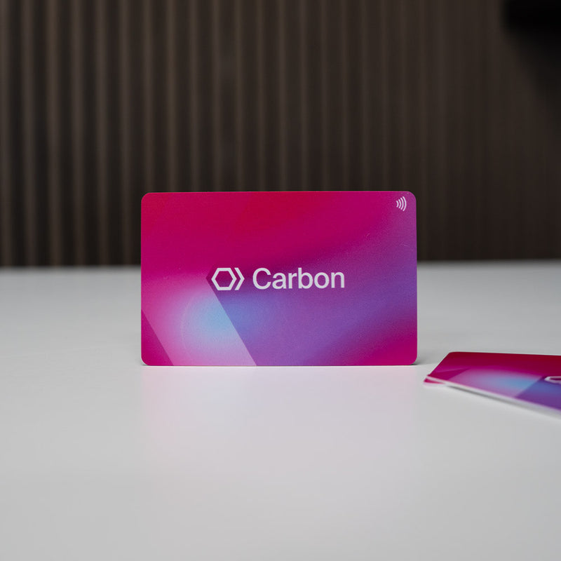 Carbon branded NFC Digital Business card with gradient pink to purple design on a white surface