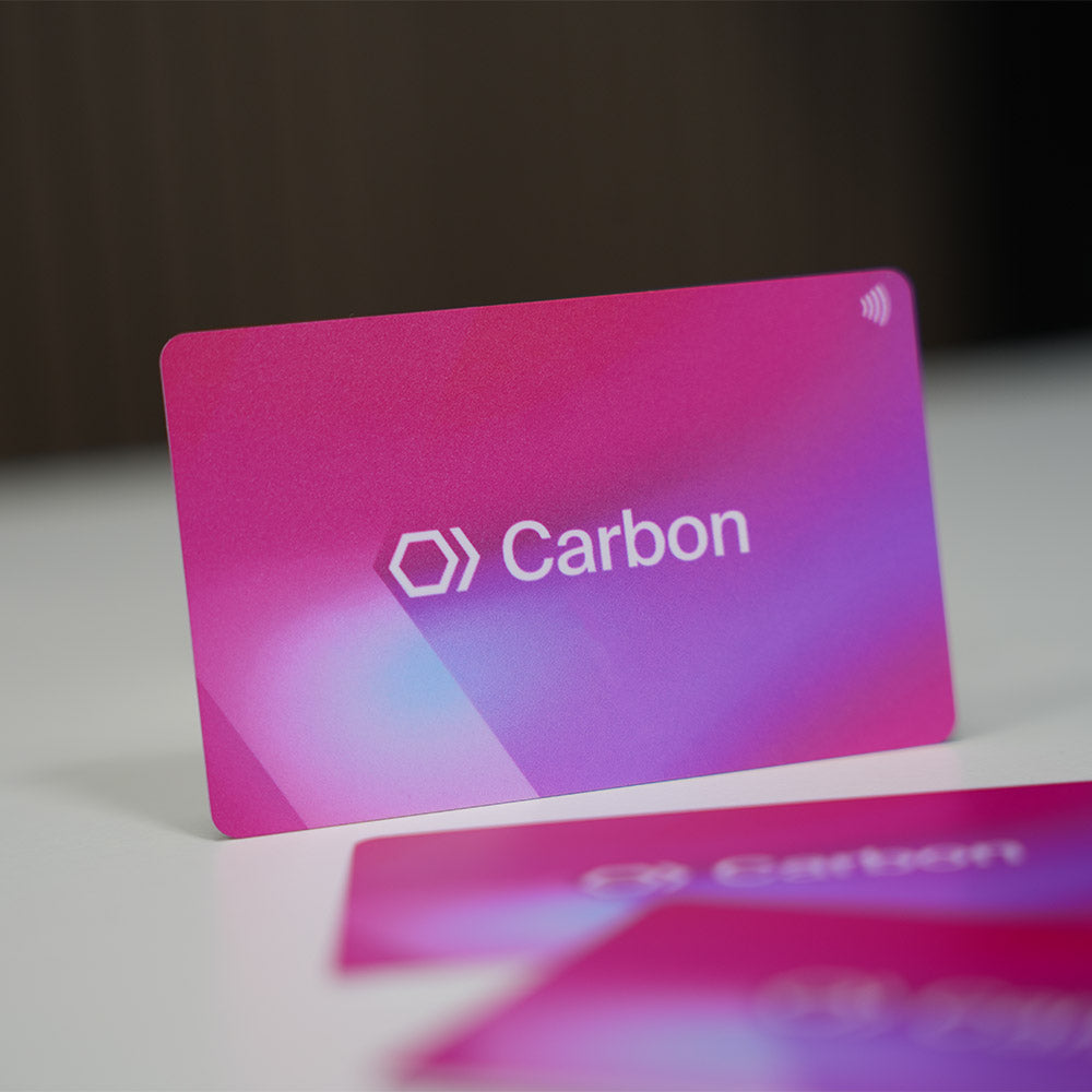 Carbon branded NFC Digital Business card with gradient pink to purple design on a white surface