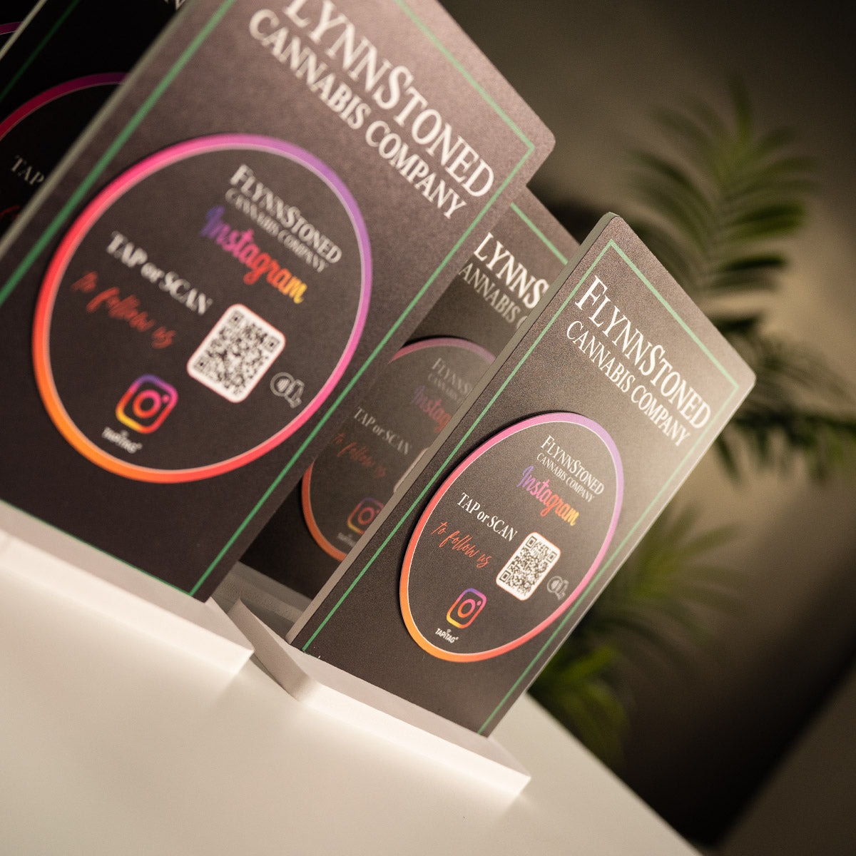 Promotional materials for FlynnStoned NYC Cannabis Company with TAPiTAG NFC TAG & QR code for Instagram social media followers.