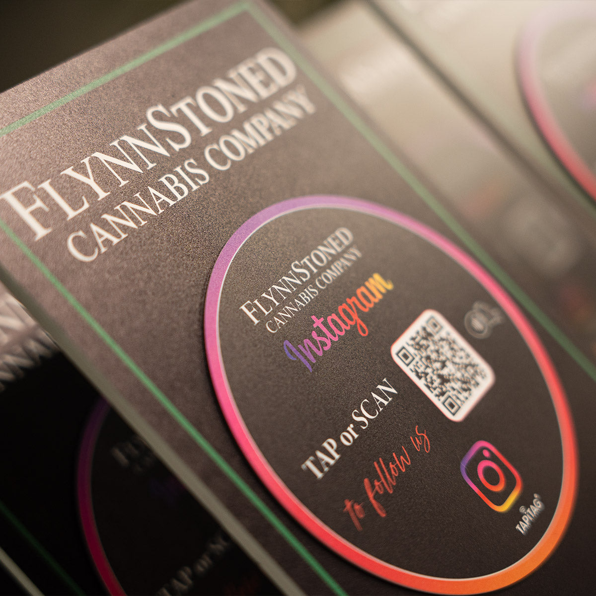 TAPiTAG Smart Display Stand Promotional materials for FlynnStoned NYC Cannabis Company with TAPiTAG NFC TAG & QR code for Instagram social media followers.
