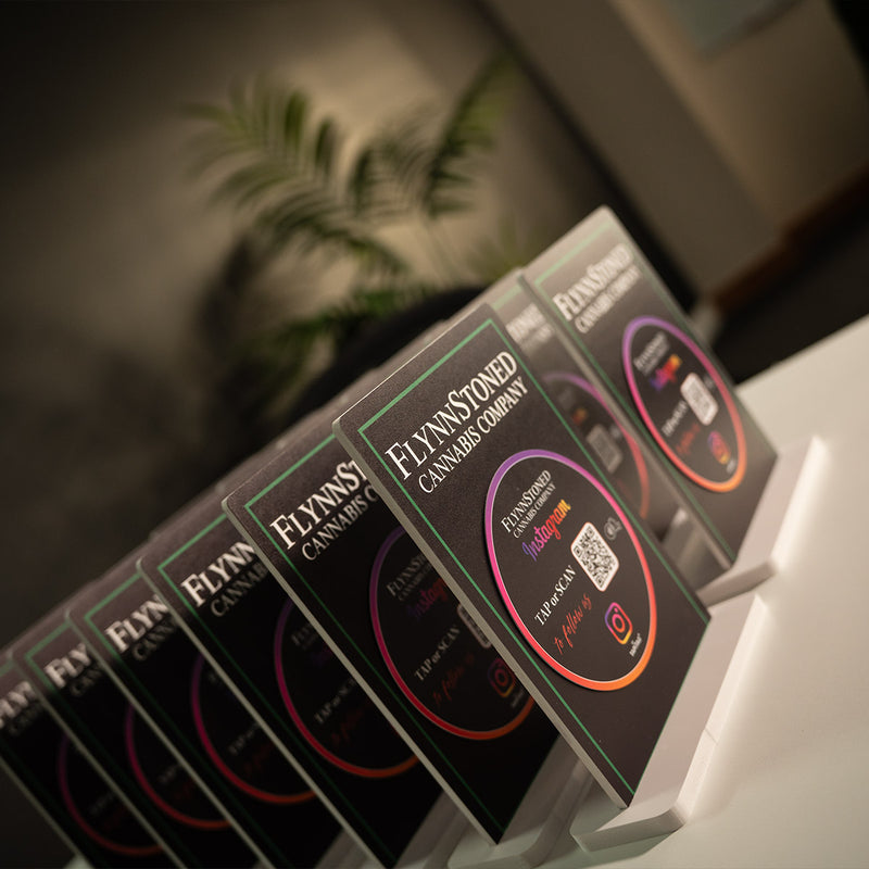 TAPiTAG Smart Display Stand Promotional materials for FlynnStoned NYC Cannabis Company with TAPiTAG NFC TAG & QR code for Instagram social media followers.