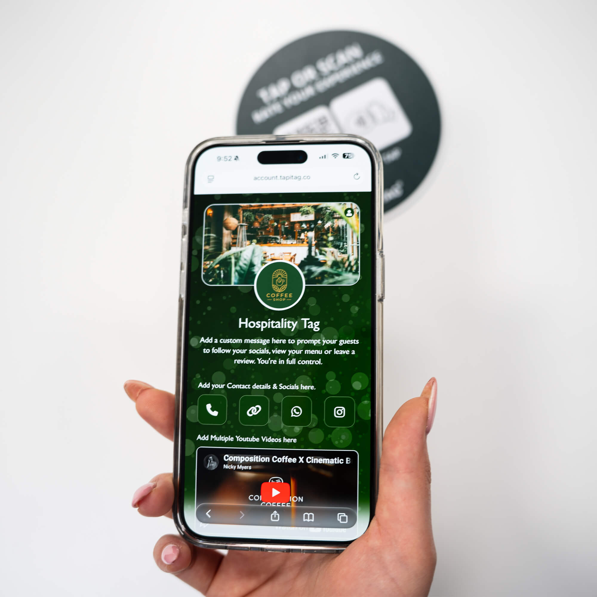 Person tapping TAPiTAG NFC hospitality tag with smartphone to access digital business profile instantly