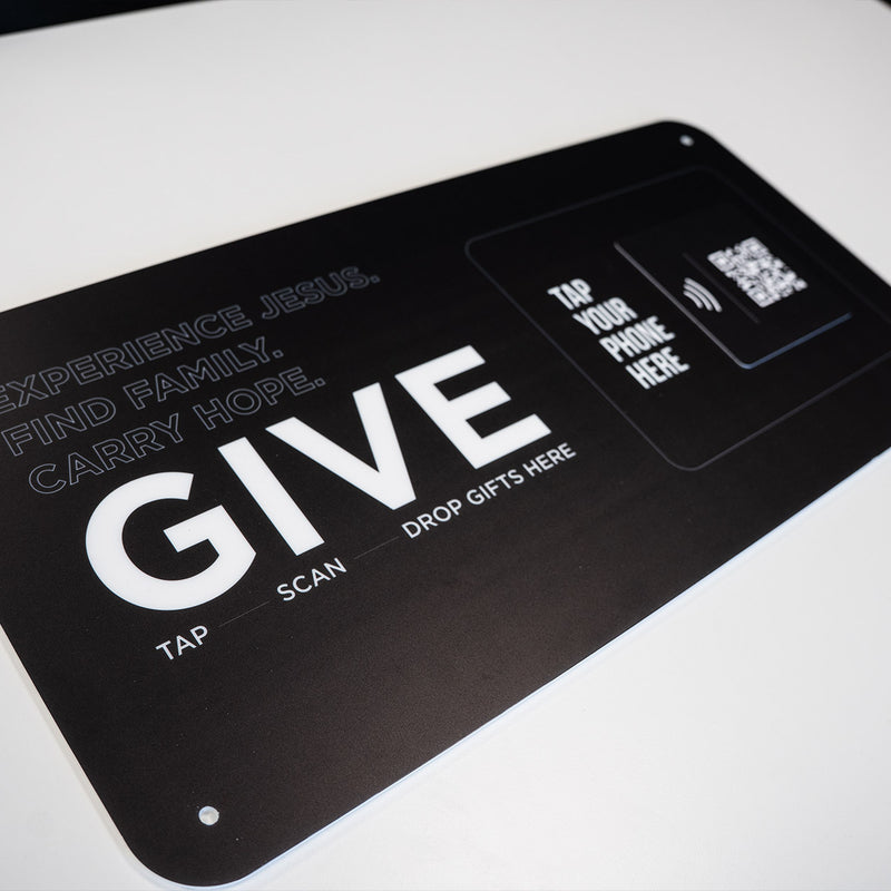 TAPiTAG Smart Display plate with QR code and text on a wall inside a building