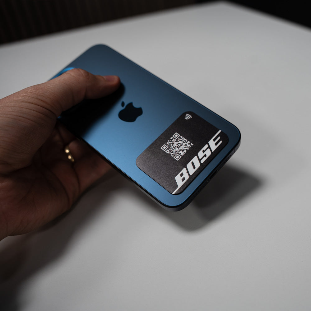 Bose phone case with QR code on a light surface. TAPiTAG NFC QR MINICARD NFC-Enabled Digital Business Card