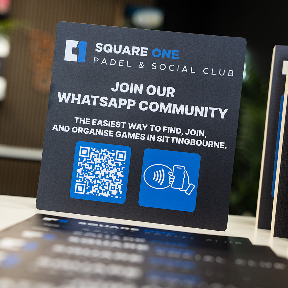 Promotional NFC TAPiTAG for Square One Padel & Social Club with QR code and contact icon on a blurred background