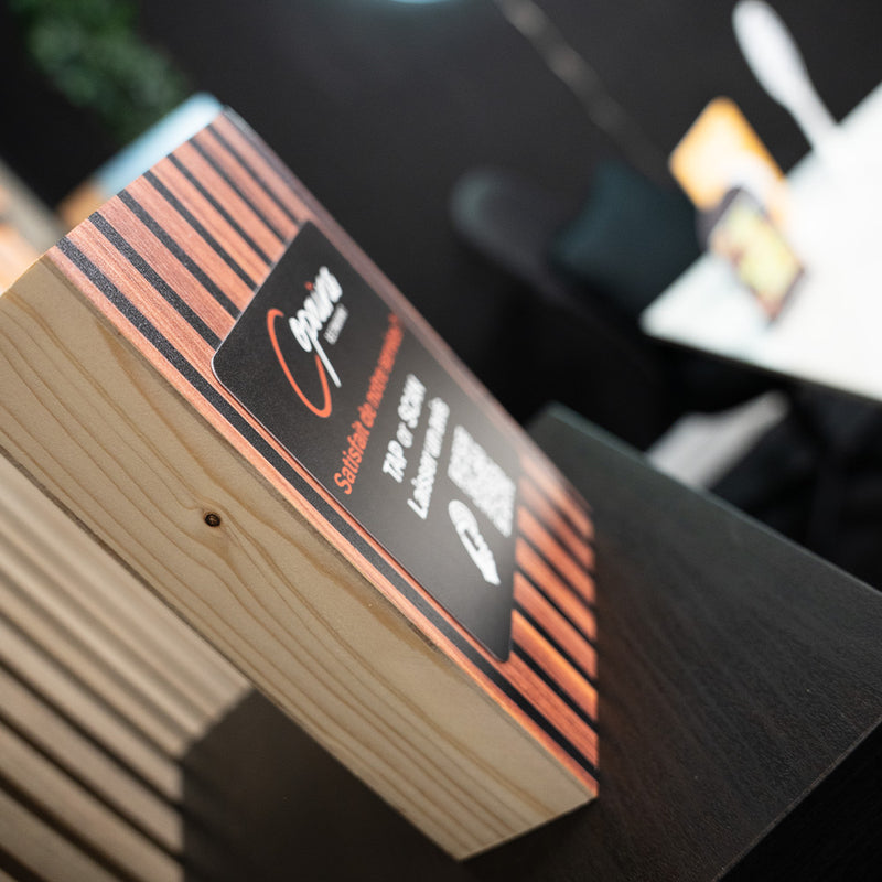 Wooden block with a label on a blurred background