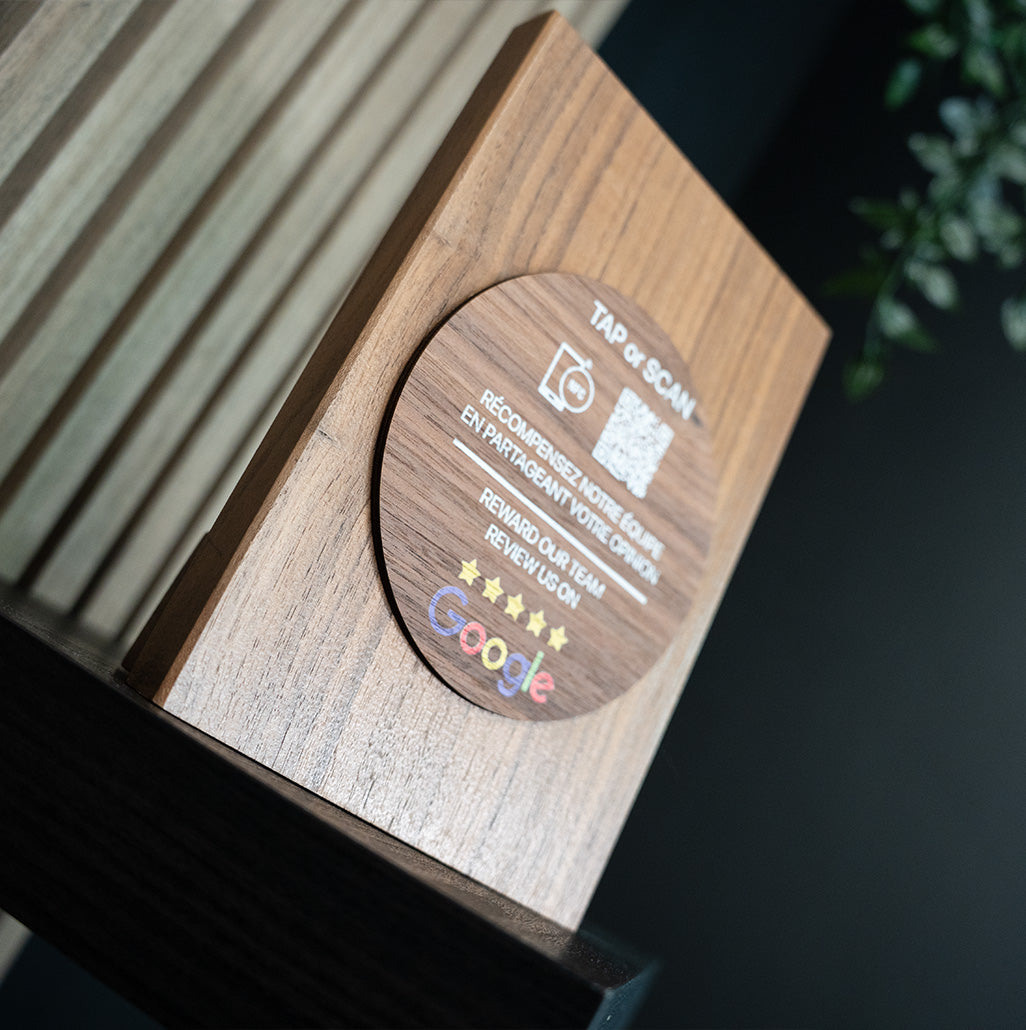 Wooden plaque with Google logo and text on a dark background